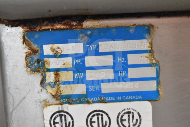 Berkel 400-A vacuum sealer label showing specifications: 208 Volts, 3 Phase, 3.0 kW, Serial 6904, made in Canada.