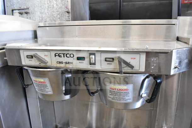 Fetco CBS-62HSt commercial countertop double coffee machine with 3 brew baskets, 120 volts, 1 phase. Visible wear marks.