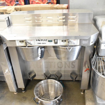 Fetco CBS-62H commercial countertop double coffee machine with 3 brew baskets, 120 volts, 1 phase, stainless steel.