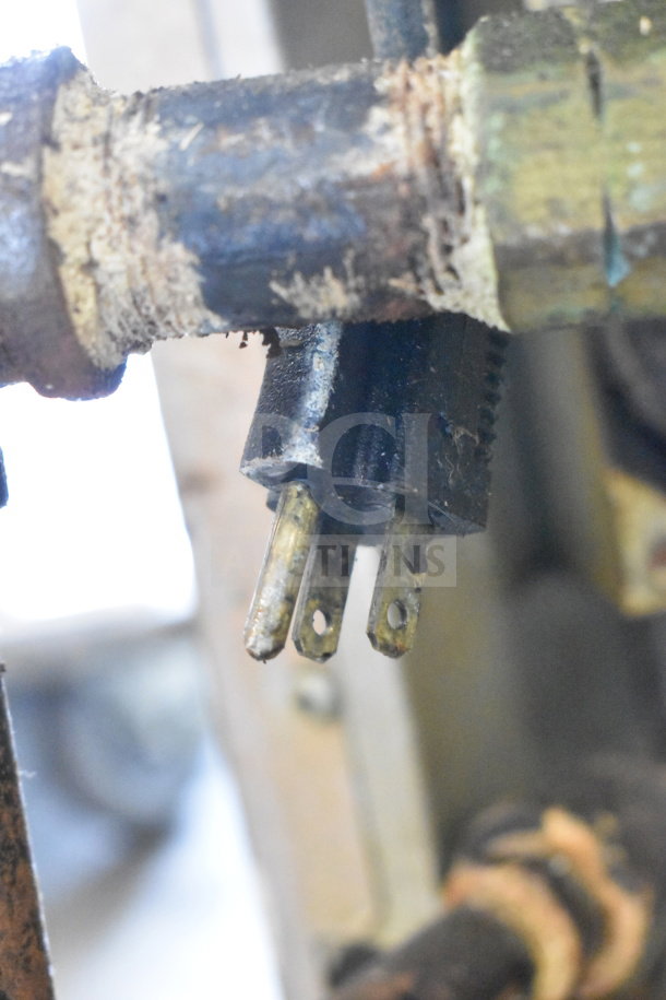 Alt text: Close-up view of metal connector component from Blodgett commercial convection oven, showing wear and rust.