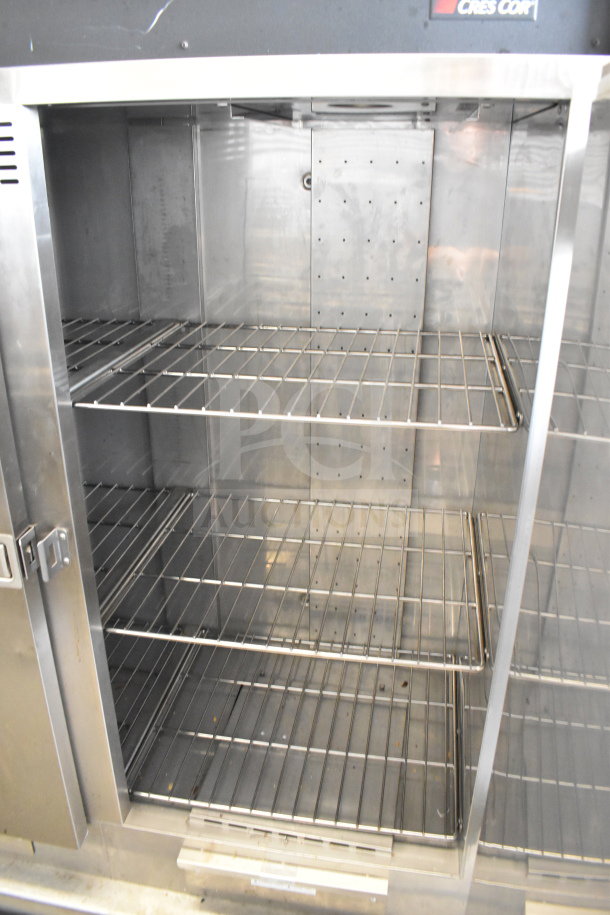 CresCor CCB150 commercial heated holding cabinet, 2 doors, stainless steel, interior racks, 120V, 1 phase, in good condition.