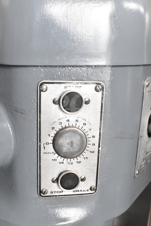 Hobart H-600T commercial dough mixer control panel, featuring dials and buttons for settings and operation, metal finish.