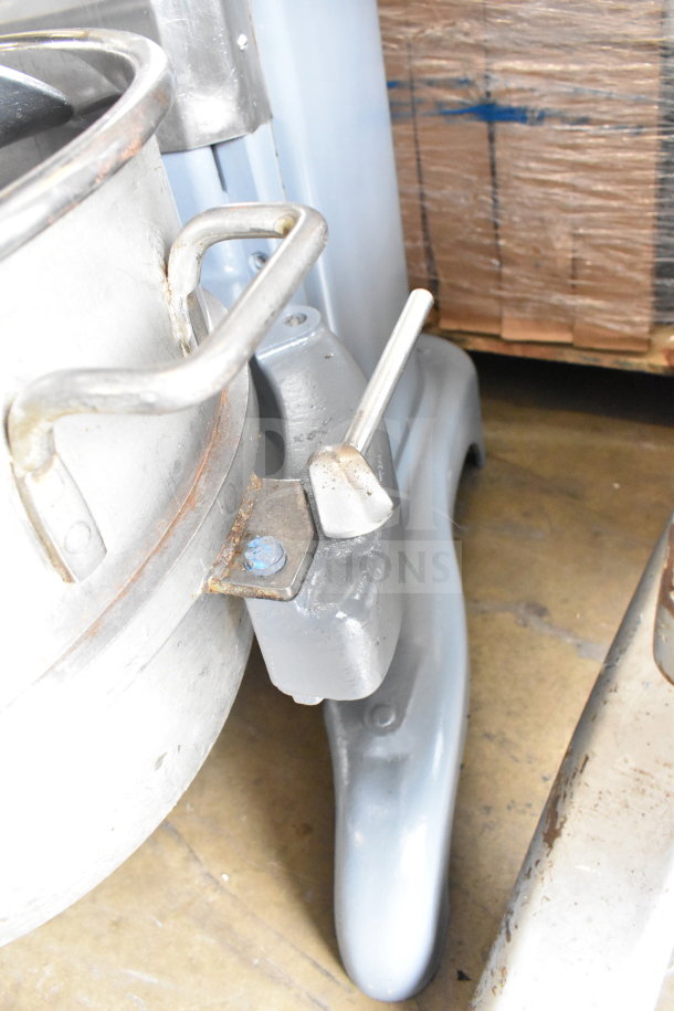 Hobart H-600T 60 Qt planetary dough mixer base, with part of the mixing bowl visible. Sturdy metal construction.
