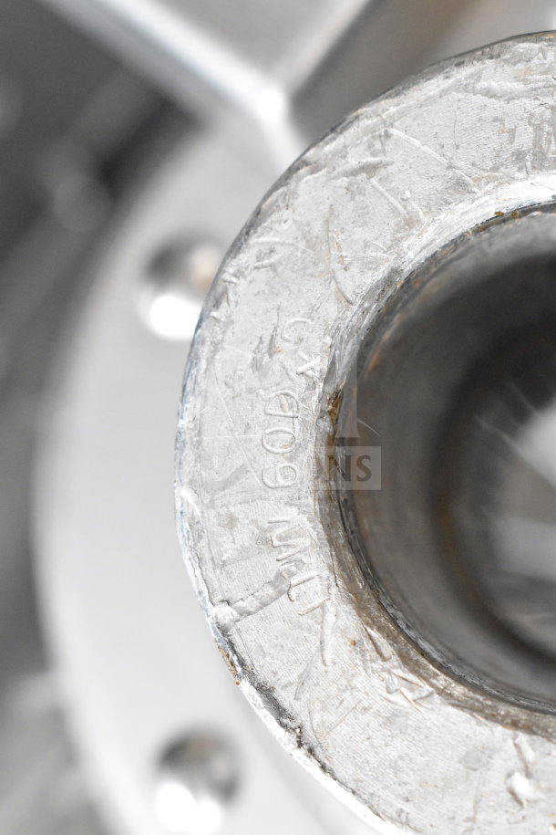 Hobart H-600T commercial dough mixer, close-up of metal surface, indicating wear and model marking.