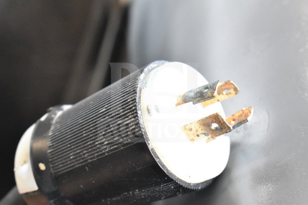 Close-up of a plug for Hobart H-600T 60-quart dough mixer's 208V, 3-phase power connection.
