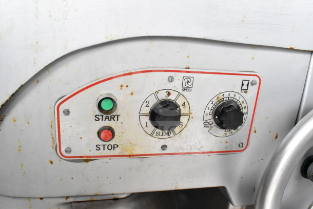 Control panel of Berkel FMS60 mixer showing speed and timer dials, with start and stop buttons, slightly worn condition.