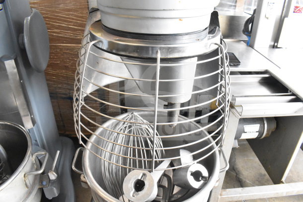 Berkel FMS60 commercial 60 qt planetary dough mixer with bowl, guard, dough hook, paddle, and whisk attachments.