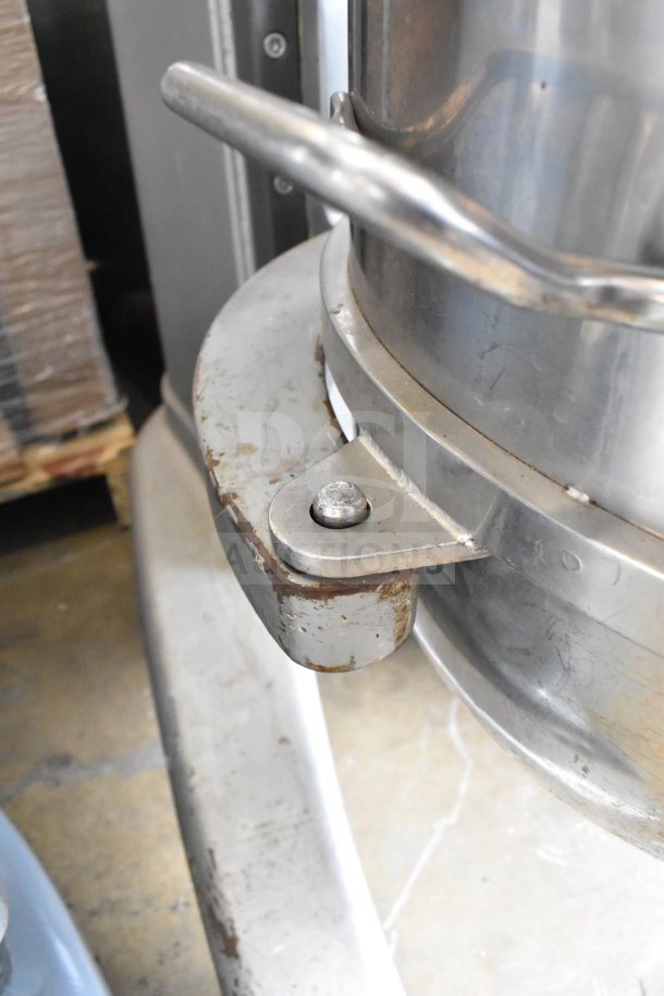 Berkel FMS60 commercial dough mixer detail, showing mixing bowl and guard, with visible wear and rust on metal parts.