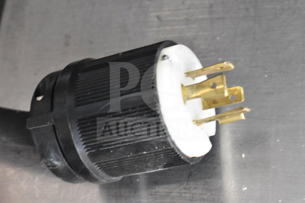 Close-up of power plug for Berkel FMS60 dough mixer, showing robust gold prongs in black casing.
