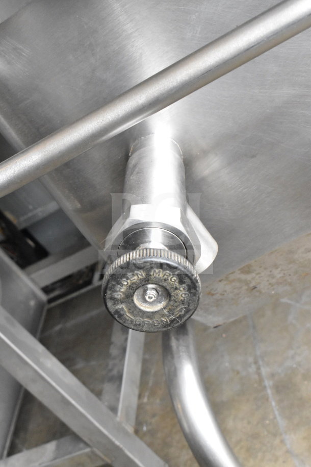 Commercial manual tilt braising pan, stainless steel, floor style, featuring a durable tilt mechanism with visible control markings.