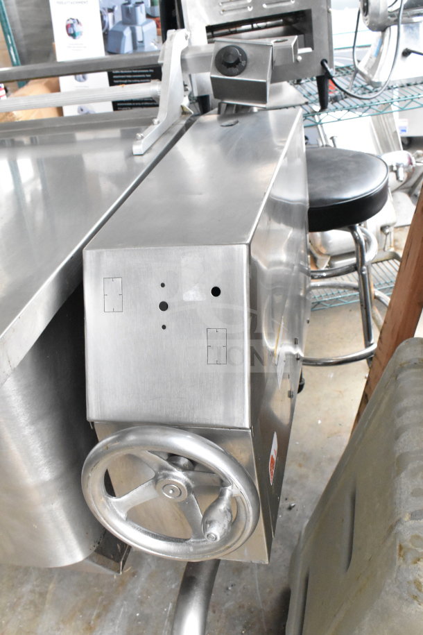 Stainless steel commercial floor-style manual tilt braising pan in good condition, equipped with a control wheel.