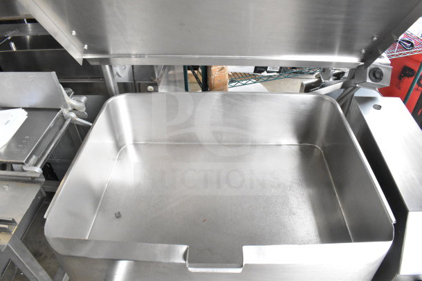 Commercial floor style manual tilt braising pan, stainless steel, open lid, clean, excellent condition, industrial use.