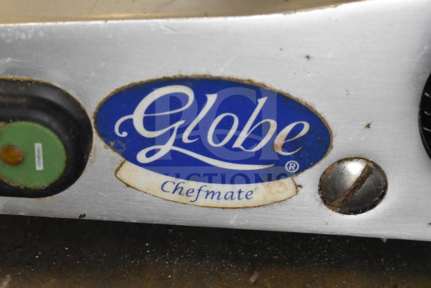 Globe C9 Commercial Meat Slicer, showing logo. Used condition, 115V, single phase. Metal body with visible wear.