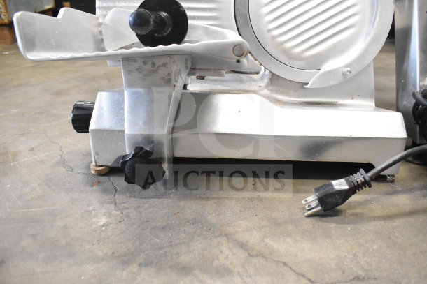 Globe C9 Commercial Meat Slicer, countertop model, 115 volts, 1 phase; shows power cord, metal surface, and adjustment knobs.