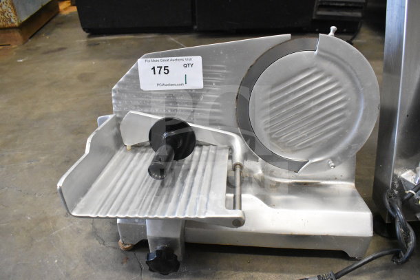 Globe C9 commercial countertop meat slicer, 115 volts, used condition, with auction tag number 175 visible.