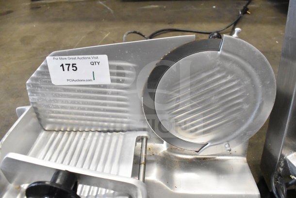 Globe C9 Commercial Meat Slicer on countertop. Features stainless steel blade. Tag reads "175". Powered by 115 volts, 1 phase.