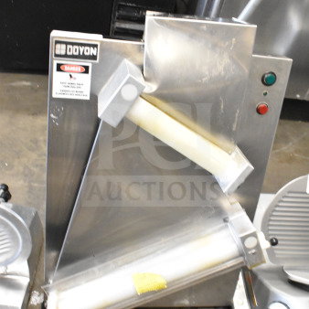 Doyon DL18DP two-stage dough sheeter, 18" countertop model, stainless steel, 120V, labeled with safety and Doyon branding.