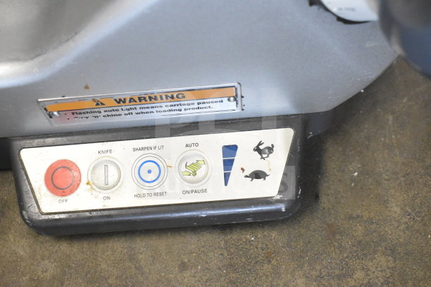 Hobart Commercial Countertop Meat Slicer controls, showing power, sharpen, auto, and speed settings. Warning label visible.