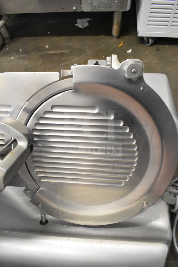 Hobart Commercial Countertop Meat Slicer, 120 Volts, 1 Phase. Stainless steel, excellent condition, features adjustment knob.