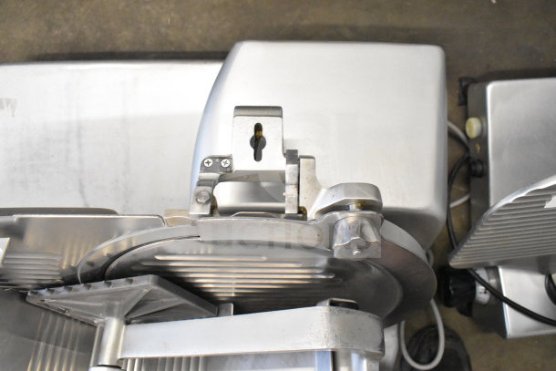 Hobart commercial countertop meat slicer, 120 volts, 1 phase, stainless steel finish, visible blade, good condition.