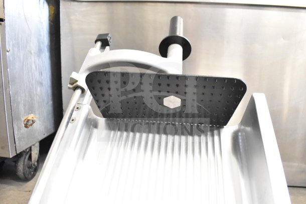 Manconi 300 IX meat slicer with blade sharpener, commercial countertop model, 120V, 1-phase, stainless steel, excellent condition.