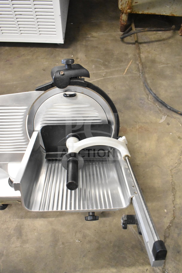 Manconi 300 IX commercial meat slicer with blade sharpener, 120V, 1 Phase; stainless steel, excellent condition.