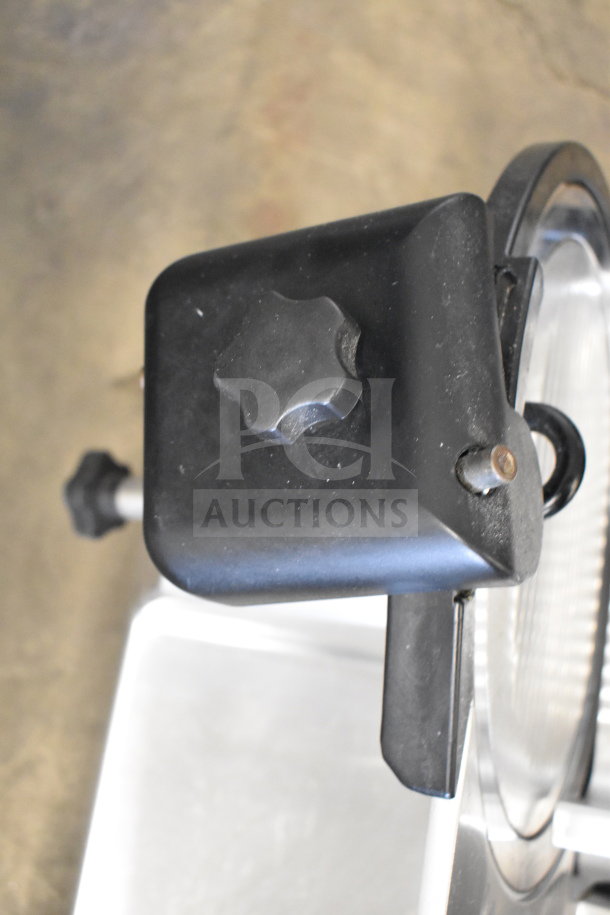 Manconi 300 IX countertop meat slicer with blade sharpener, 120V, 1 Phase, in good condition.