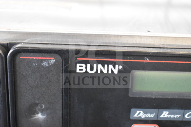 2018 Bunn AXIOM 0/6 TWIN coffee machine panel, showing digital display and brand logo.