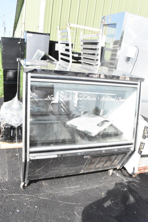 2018 Leader ERCD48ES Commercial Deli Display Case, floor style. 115 Volts, 1 Phase. Glass panels, moderate condition.