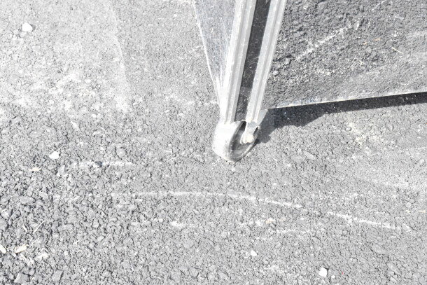 Alt text: Close-up of a wheel on the 2018 Leader ERCD48ES Deli Display Case. Exhibits worn condition, suitable for floor display.