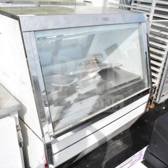 Commercial floor-style deli display case, durable stainless steel, glass front, spacious interior, minor wear visible.