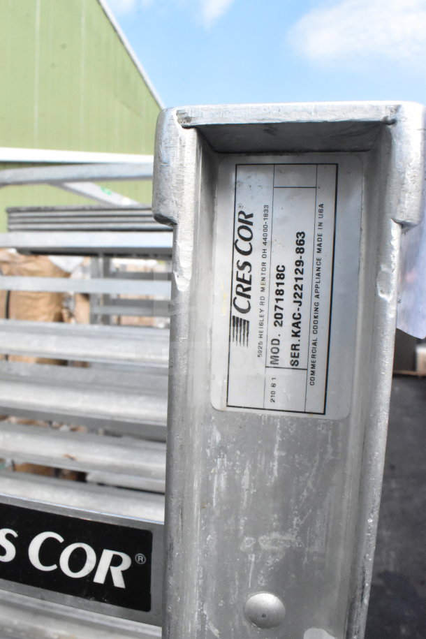 Commercial Cres Cor pan transport rack with 36 baking pans, on casters. Model 2071818C, serial KACJ22129-863. Made in USA.