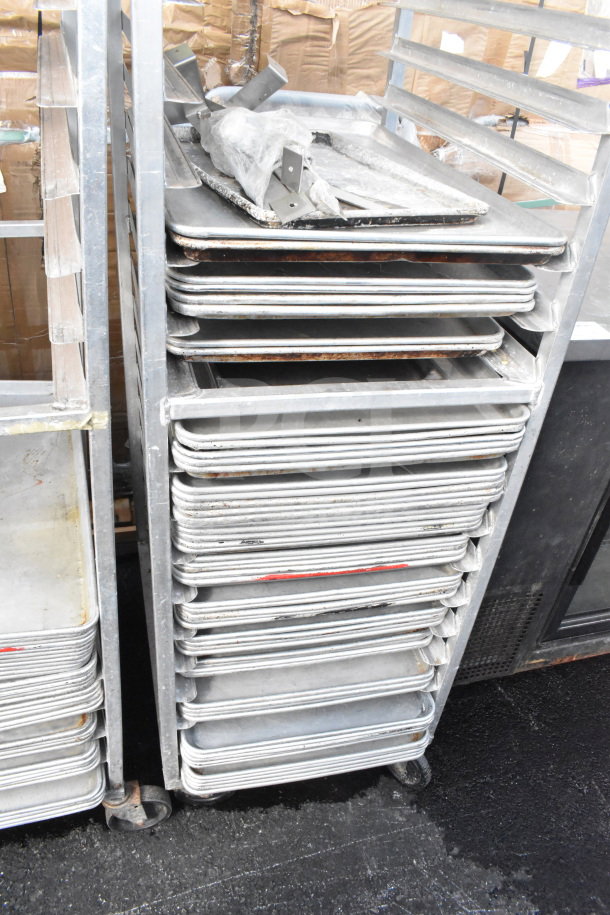 Commercial pan transport rack with casters, holding 60 baking pans. Sturdy metal frame, suitable for efficient kitchen storage.
