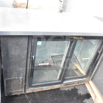 True TBB-24-48G-SD commercial 2-door back bar cooler merchandiser, glass doors, black exterior, 115V, good condition.
