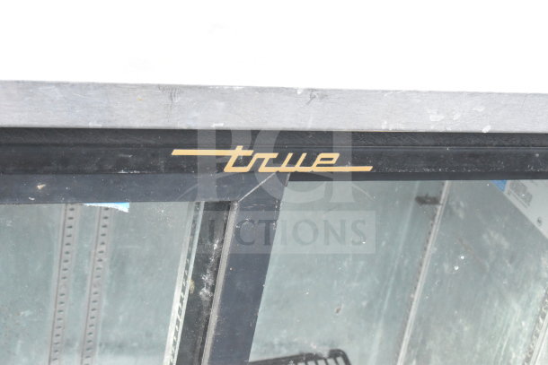 True TBB-24-48G-SD commercial 2 door back bar cooler, glass front, black frame, True logo, 115 volts, 1 phase.