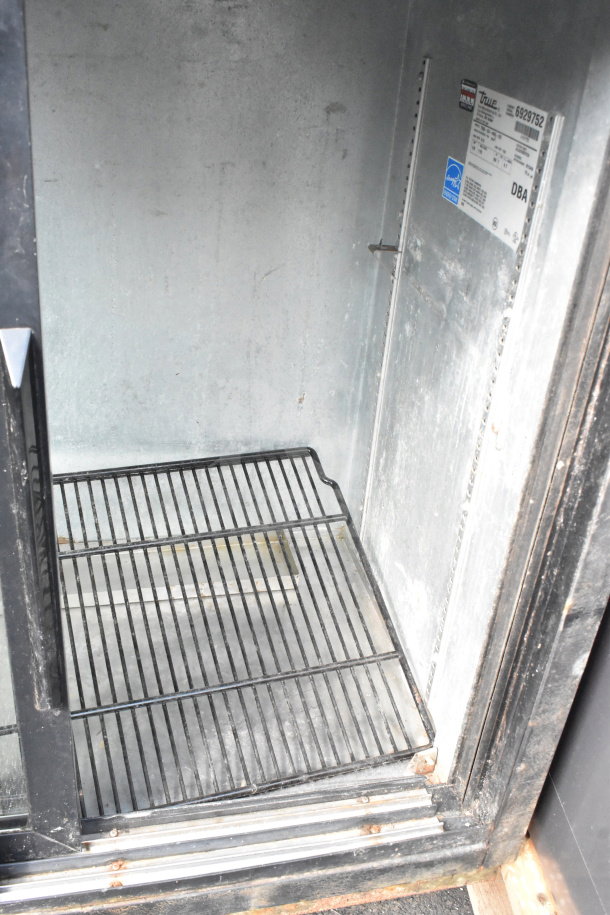 True TBB-24-48G-SD Commercial 2 Door Back Bar Cooler, used condition, 115V, interior shelving, brand and model labels visible.