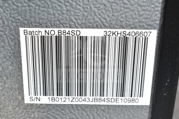 Barcode label on mini cooler showing Batch No. B84SD and S/N 1B0121Z0043JB84SDE10980. Item includes Hisense, Arctic King models, 115 volts, 1 phase.