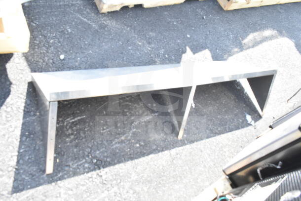 Metal two-shelf unit, sturdy design, moderate condition, suitable for industrial or home use. No visible markings.