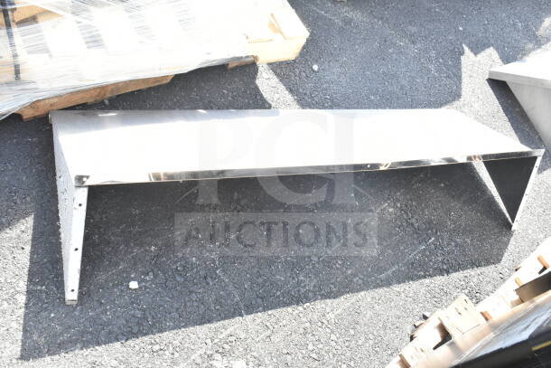 Stainless steel two-shelf unit with polished finish, in good condition, suitable for industrial or commercial use.