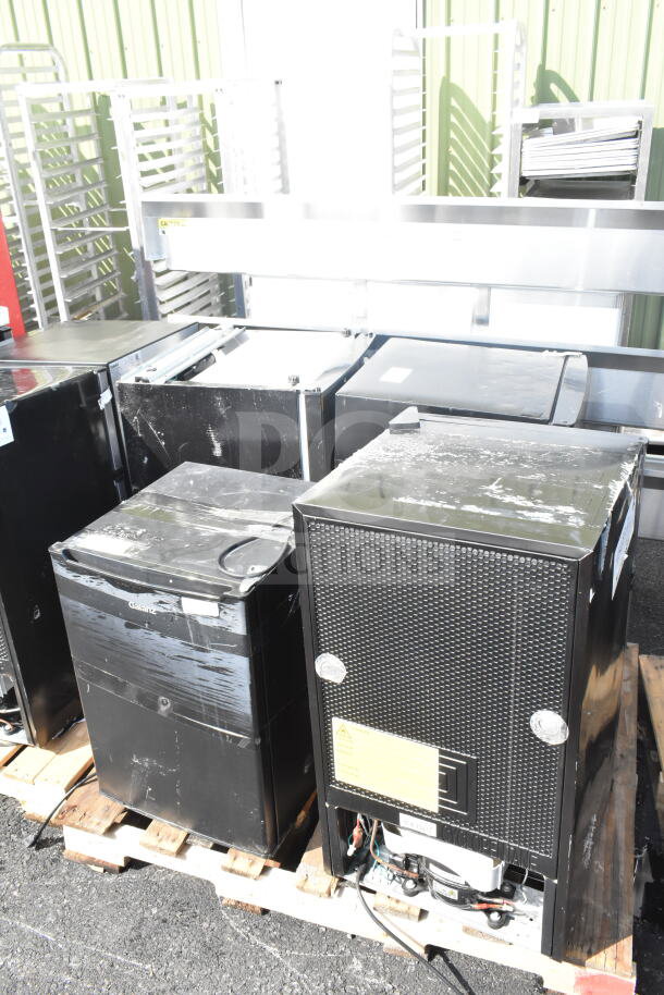 Four mini coolers including Galanz, 115 volts, 1 phase, on pallets. Visible wear, labels, and operational components.
