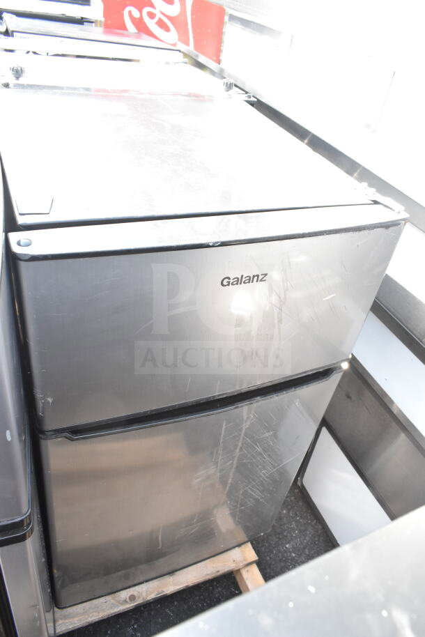 Four mini coolers including a Galanz model, 115 volts, 1 phase, showing surface wear, ideal for compact refrigeration.