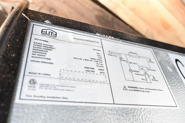 Label on mini cooler showing specifications: Elite Home Product, 115V, 60Hz, 0.8A. Dimensions: H33-1/4" x W20-1/2" x D21-1/4". Made in China.