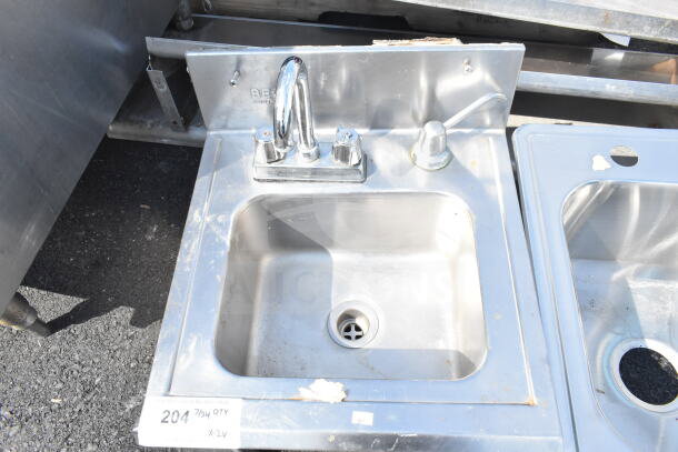 Stainless steel single bay sink with faucet, slight wear, suitable for drop-in installation, includes two units per bid.