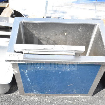Commercial drop-in ice bin, stainless steel, used condition, visible surface wear, marked "205" for identification.