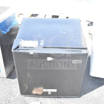 Whynter CUF-110 Mini Freezer, black, visible scratches, 115 Volts, 1 Phase, label shows brand and model.