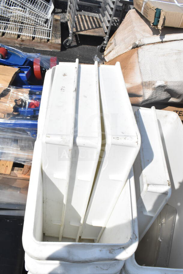 Stack of white plastic ingredient and dough bins; some show wear and marks. Includes multiple storage items.