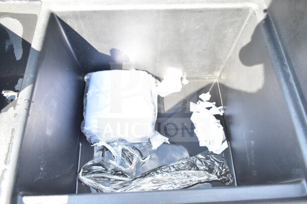 Brand new Cambro BAR540110 Cambar® Black 54" portable bar interior; visible packaging material inside.