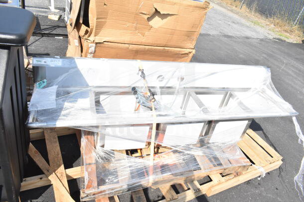BRAND NEW Regency 600S31717218 Commercial 3 Bay Sink with dual drain board, scratch and dent condition, on pallet.