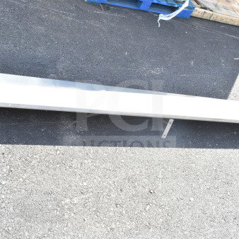 Steel shelf, rectangular, outdoor setting, good condition, elongated shape, suitable for storage or display.