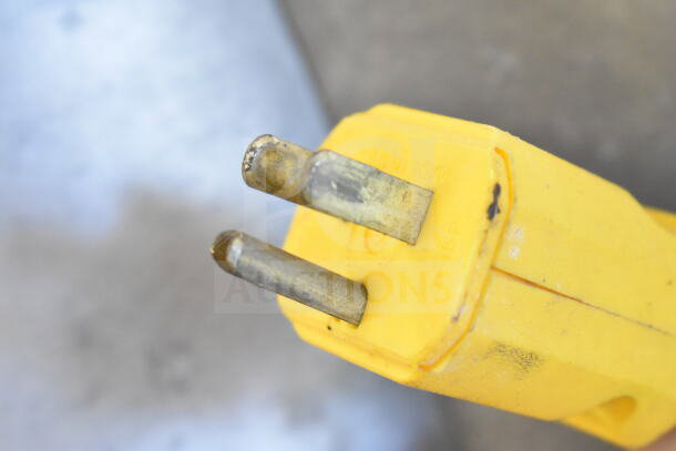 Yellow power plug for P15 Commercial Potato Peeler Barrel, showing visible wear and metal prongs.